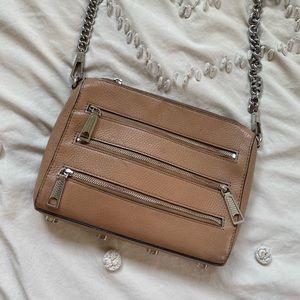 Rebecca Minkoff tan crossbody purse with three front zippers + adjustable strap